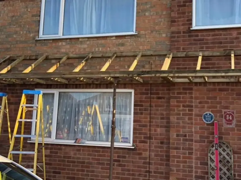 Porch roof being rebuilt