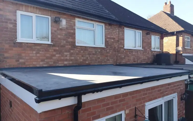 New flat roof on a rear extension with new fascia and guttering