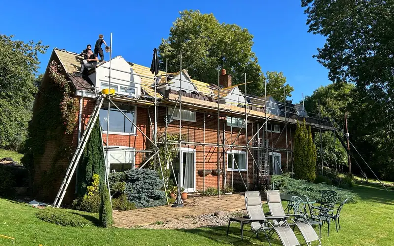 Full re-roof on a large family home with scaffold up