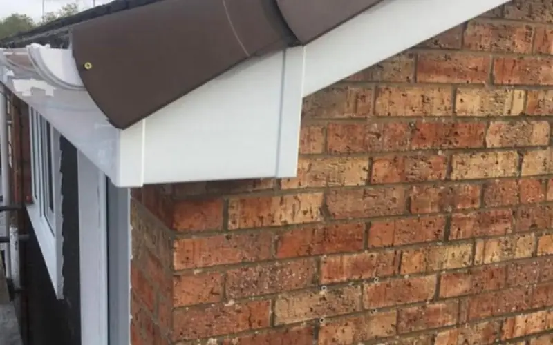 New white fascia, soffit and guttering on a brick house