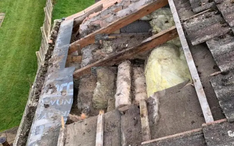 Damaged section of roof stripped back for repair