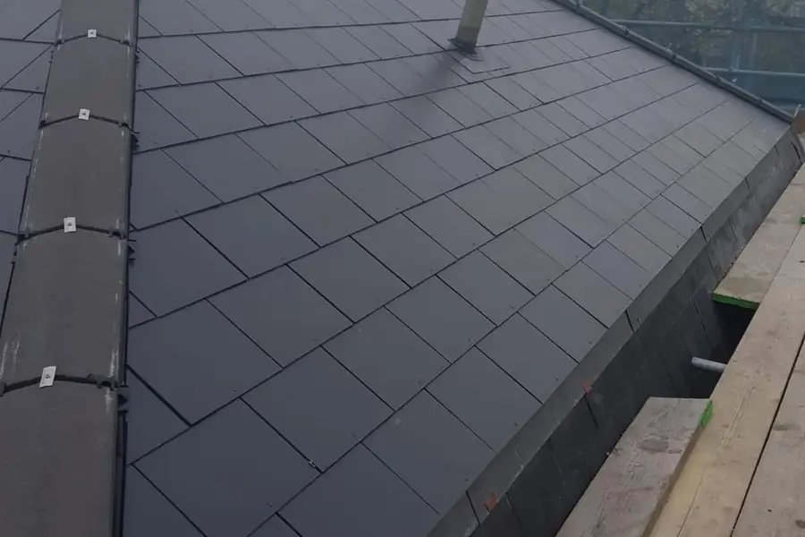 Newly fitted slate roof with a dry verge