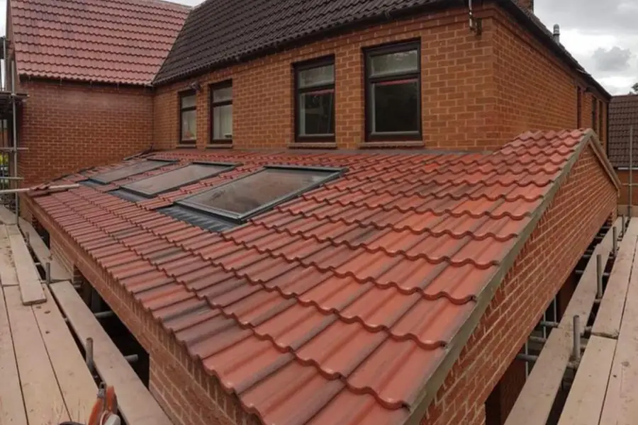 Red concrete tiled roof with new rooflights